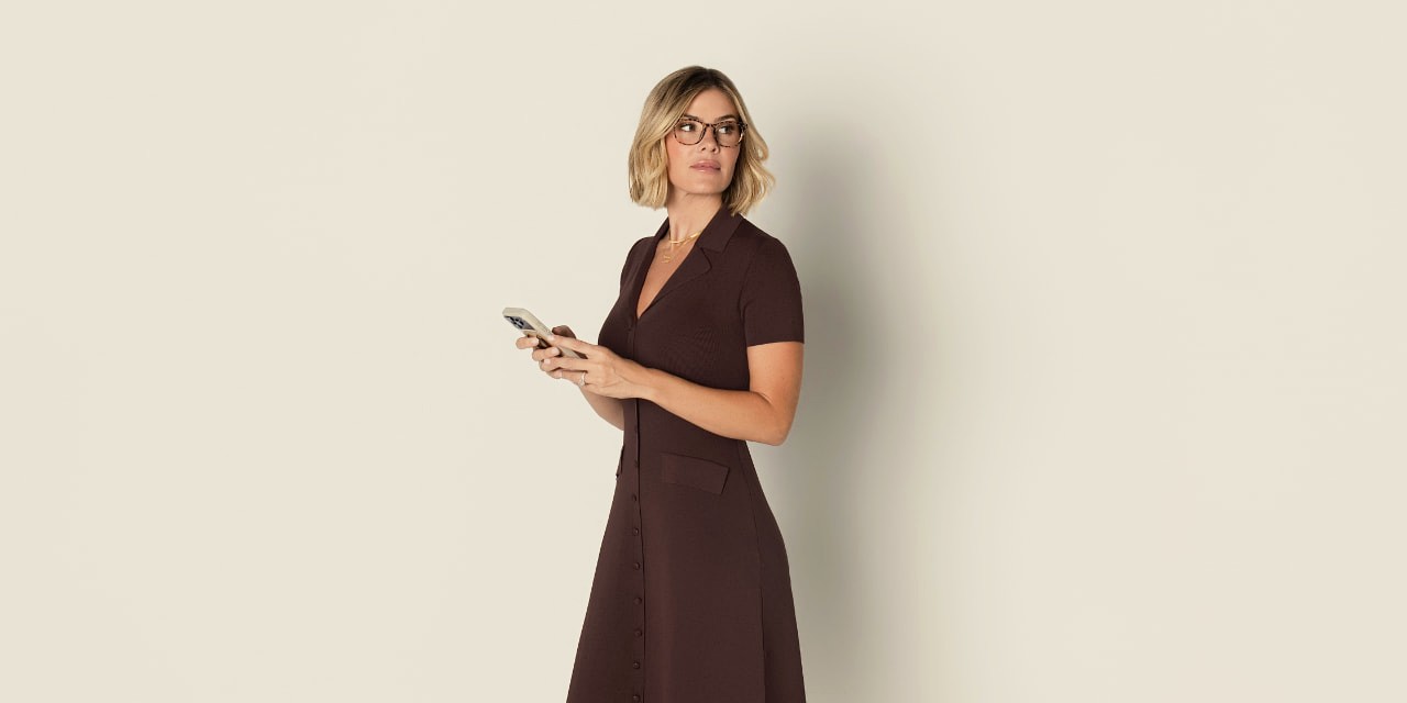 Corinne Curran, FNP-C, smiling in a chocolate dress